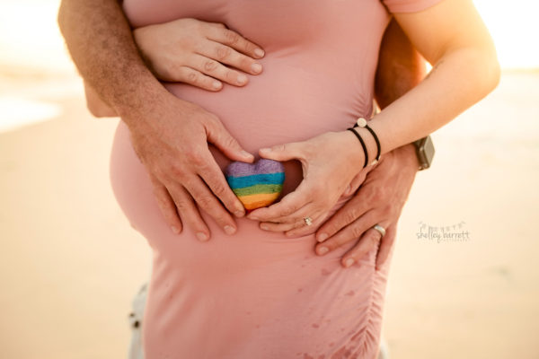 Pregnant mom takes maternity pictures with her children at Pensacola Beach, Florida.