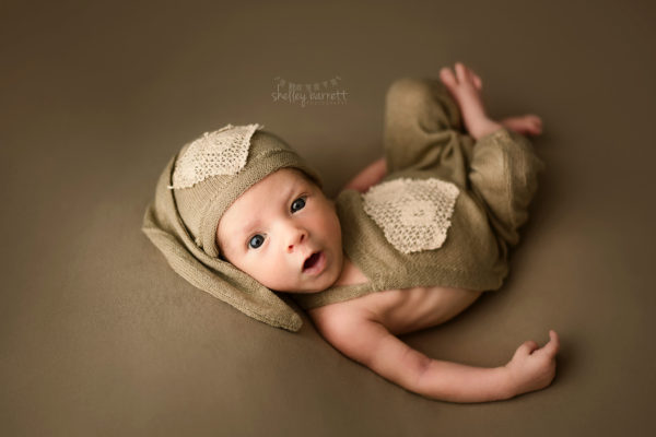 Newborn baby boy takes elegant portraits at Pensacola Photography studio.