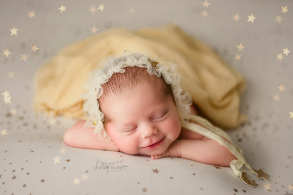 Newborn baby girl take portraits at Pensacola Photography studio.