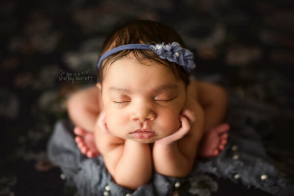 Pensacola, Florida newborn and family photographer, Shelley Barrett Photography takes adorable photos of a sweet baby girl in her Pace, Florida photography studio.