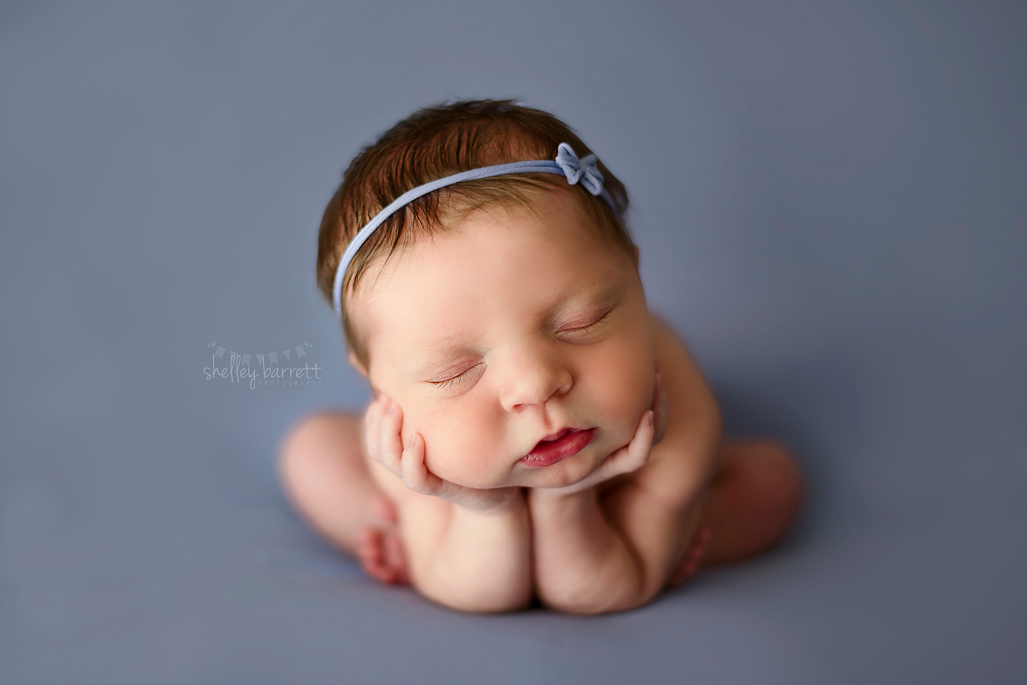 Pensacola, Florida newborn aand family photographer, Shelley Barrett Photography takes adorable photos of a sweet baby girl in her Pace, Florida photography studio.