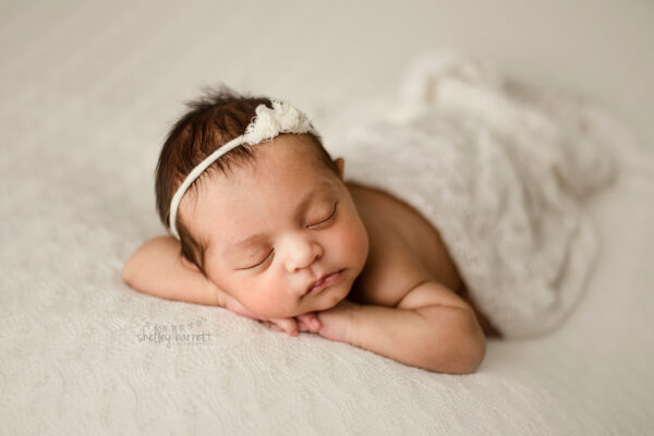 Pensacola, Florida newborn and family photographer, Shelley Barrett Photography takes adorable photos of a sweet baby girl in her Pace, Florida photography studio.