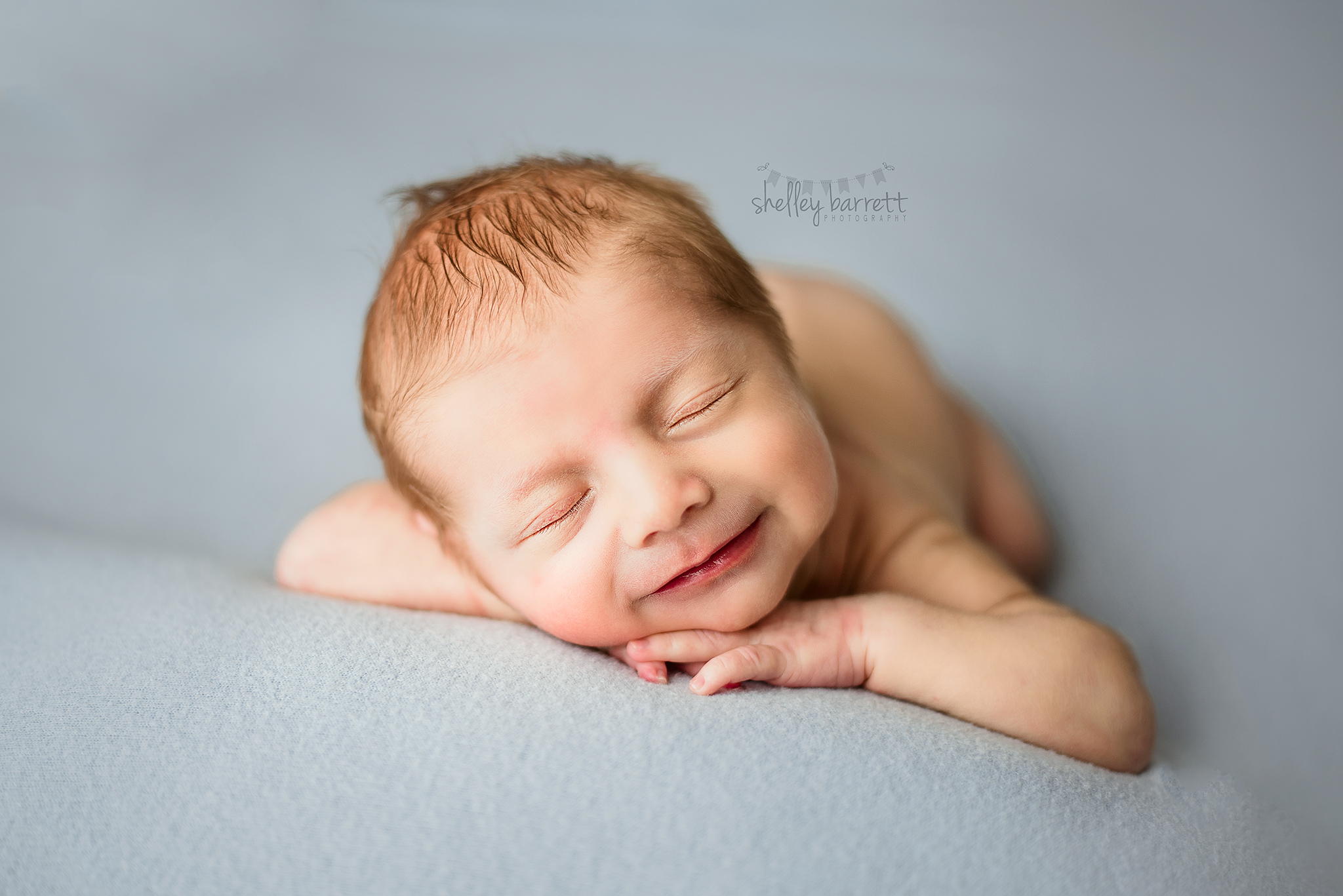 Pensacola, Florida newborn and family photographer, Shelley Barrett Photography takes adorable photos of a sweet baby boy in her Pace, Florida photography studio.