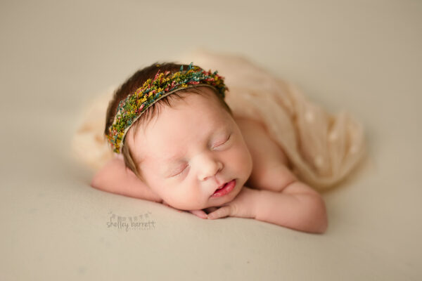 Pensacola, Florida newborn and family photographer, Shelley Barrett Photography takes adorable photos of a sweet baby girl in her Pace, Florida photography studio.