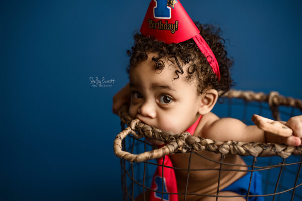 Cake smash baby portraits for one year old birthday boy David at Pensacola area Pace Florida photographer studio with Shelley Barrett Photography