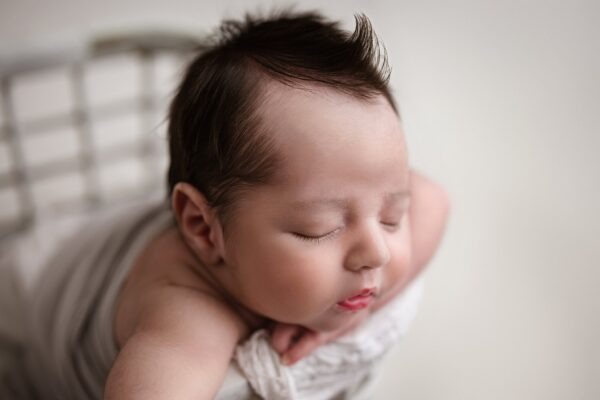 Close-up of newborn baby hair photographed by a professional newborn photographer in Birmingham, Alabama.