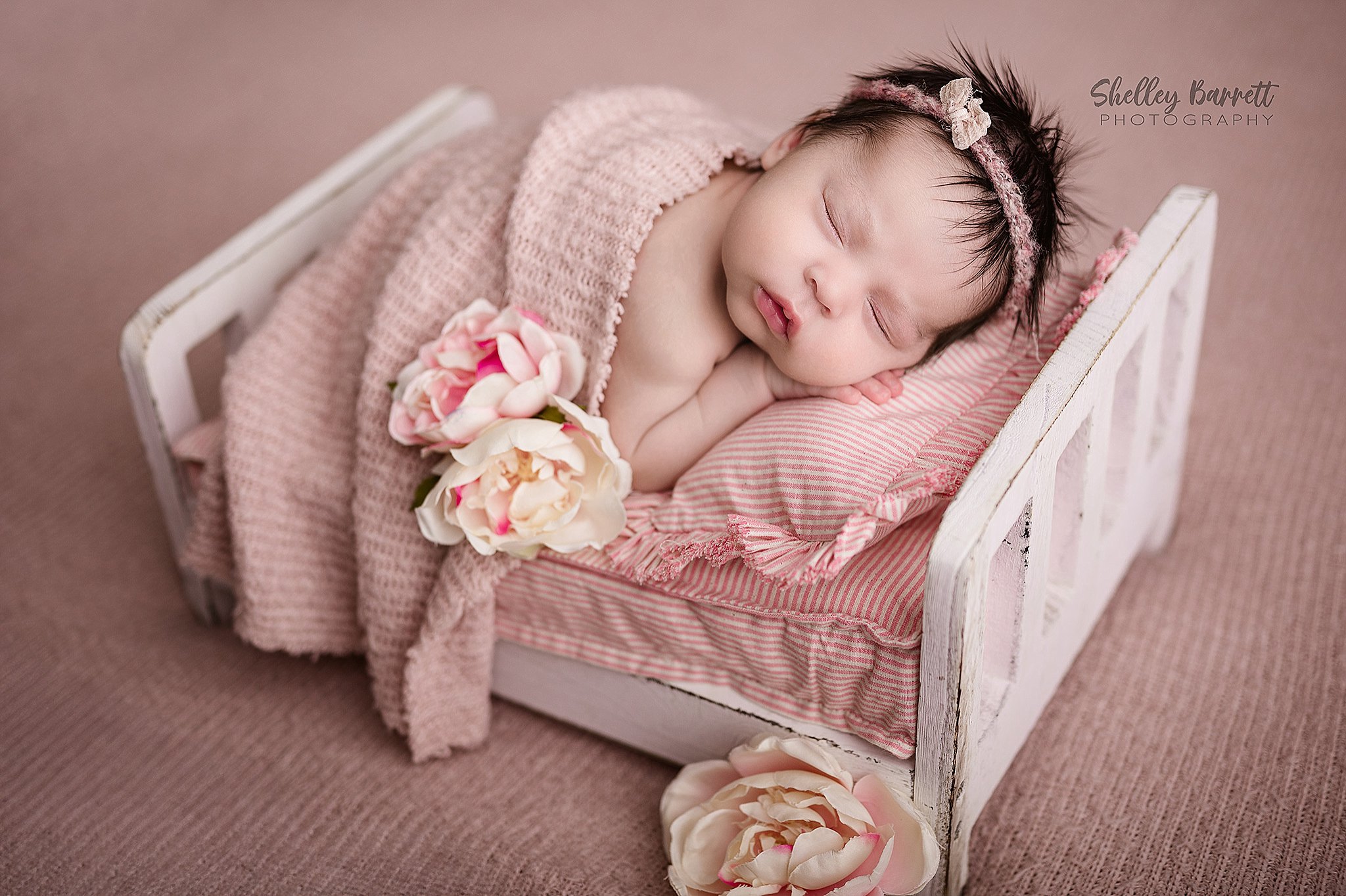 Sleeping newborn photographed by a Birmingham newborn photographer in Springville, Alabama