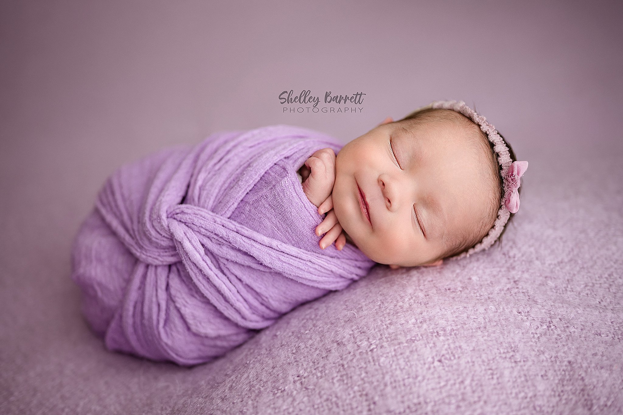 Professional newborn photographer posing newborn safely in Trussville Alabama