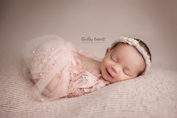 Professional newborn photographer posing newborn safely in Springville Alabama