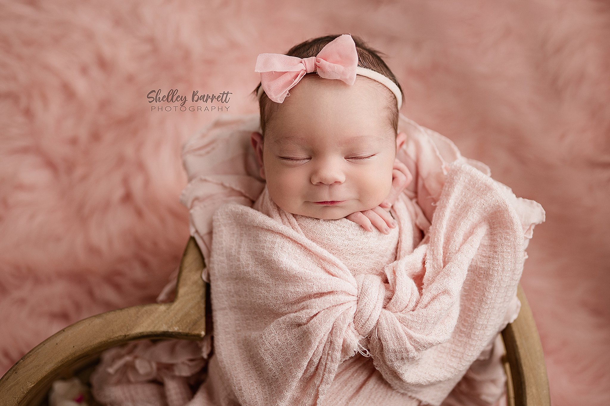 Professional newborn photographer posing newborn safely in Springville Alabama