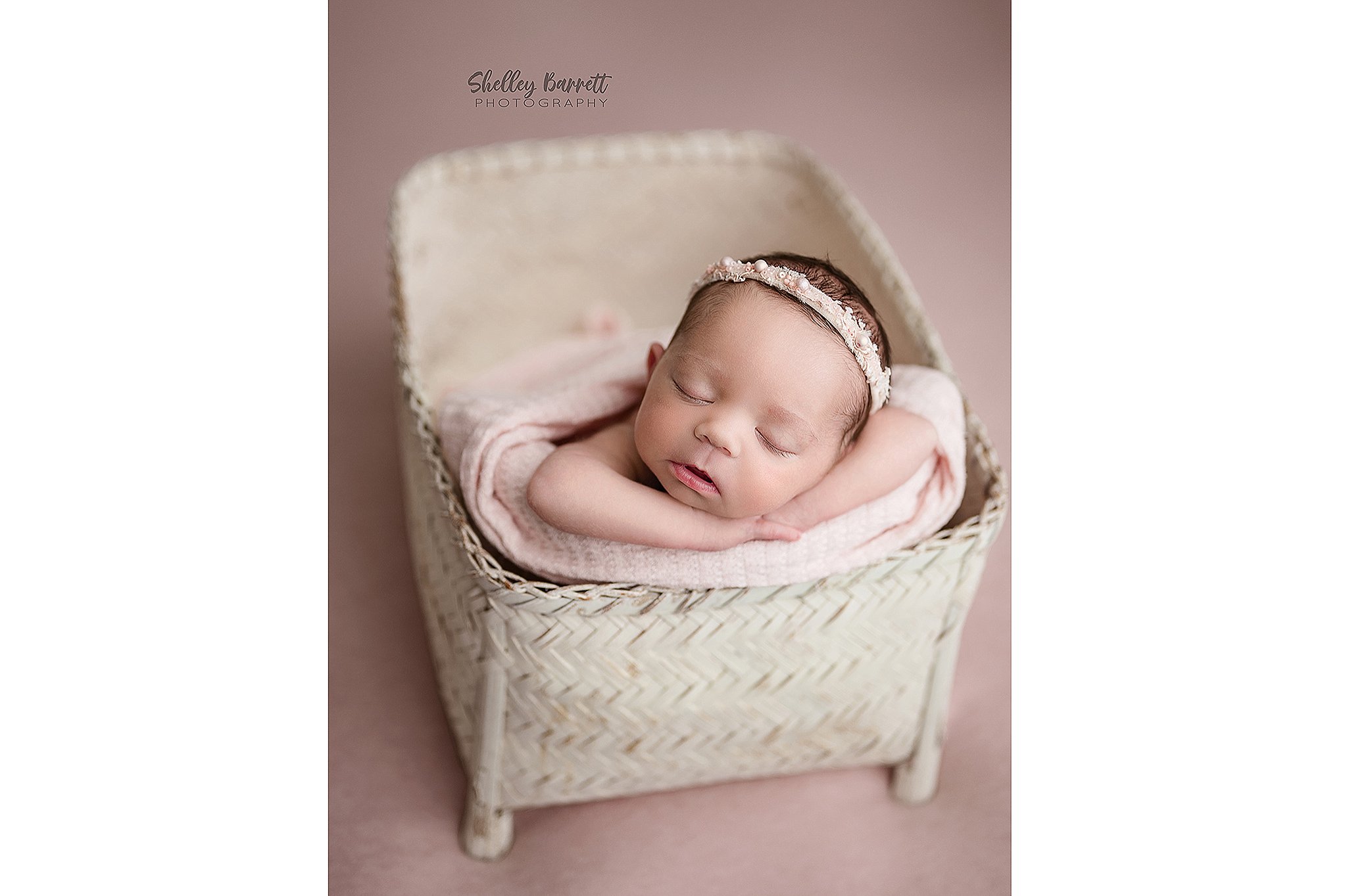 Professional newborn photographer posing newborn safely in Birmingham Alabama
