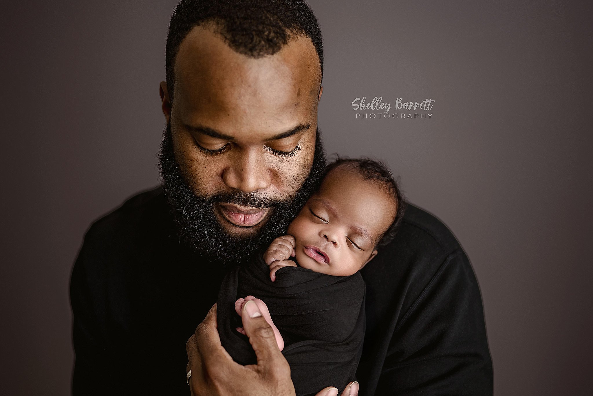 Father and newborn connection captured during a professional newborn photography session