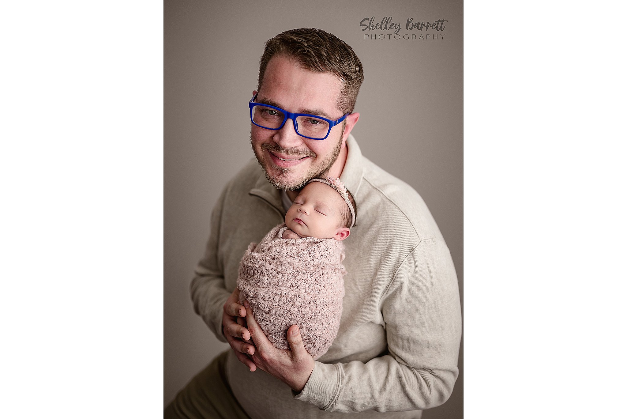 Sweet father and baby moment captured in a Springville Alabama newborn photography studio