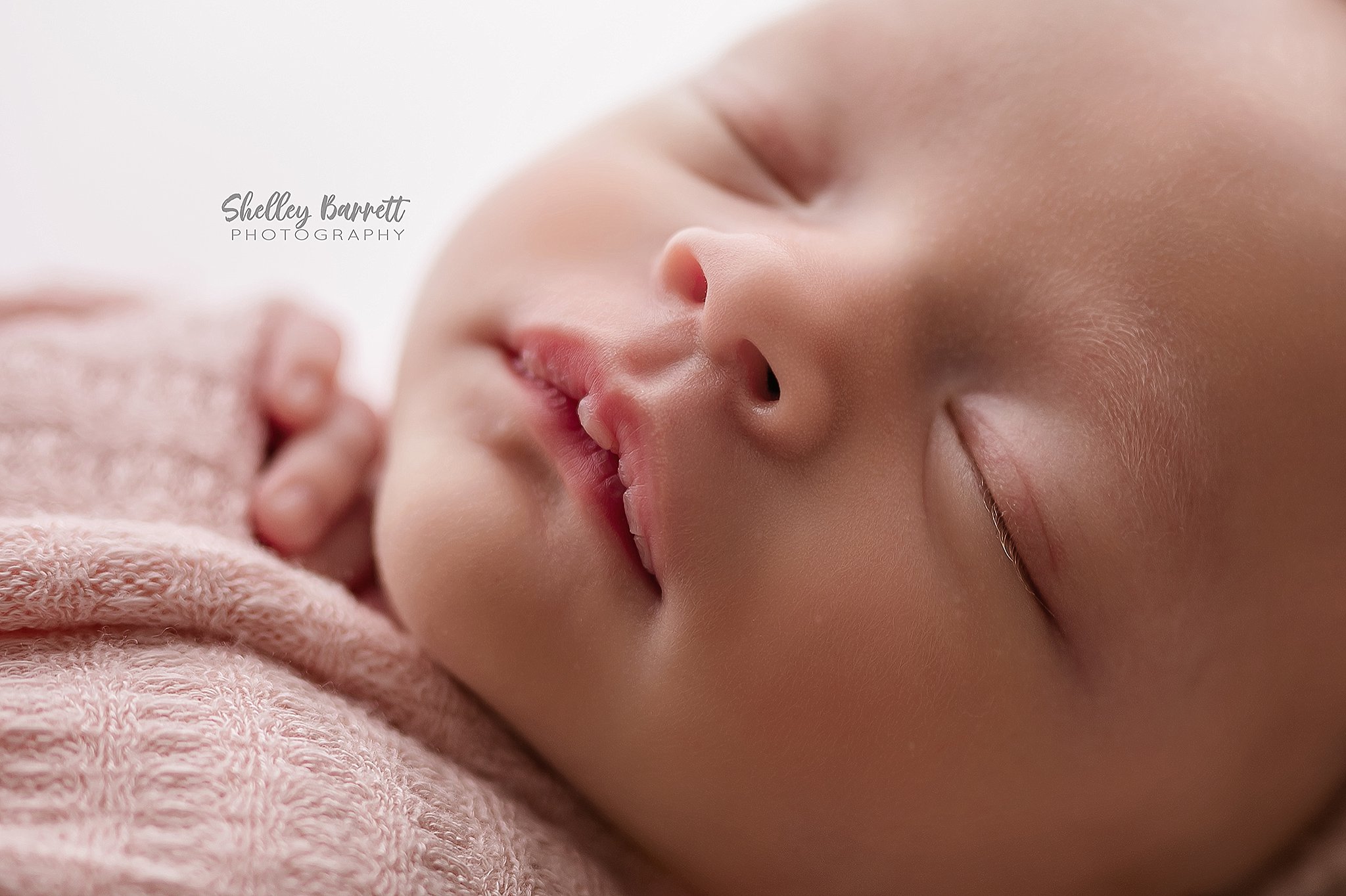 Close-up of tiny newborn lips captured by a professional newborn photographer in Alabama